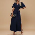 Yemelia navy blue V-neck flutter sleeve maxi dress with defined waist and side slit. Elegant, flowing silhouette for events.