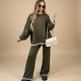 Yemelia olive green knit lounge set with contrast trim on crew neck, cuffs, and hem. Relaxed fit sweater and wide-leg pants.