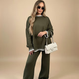 Yemelia olive green knit set with oversized sweater and wide leg pants, featuring white contrast trim detail. Soft knit fabric.