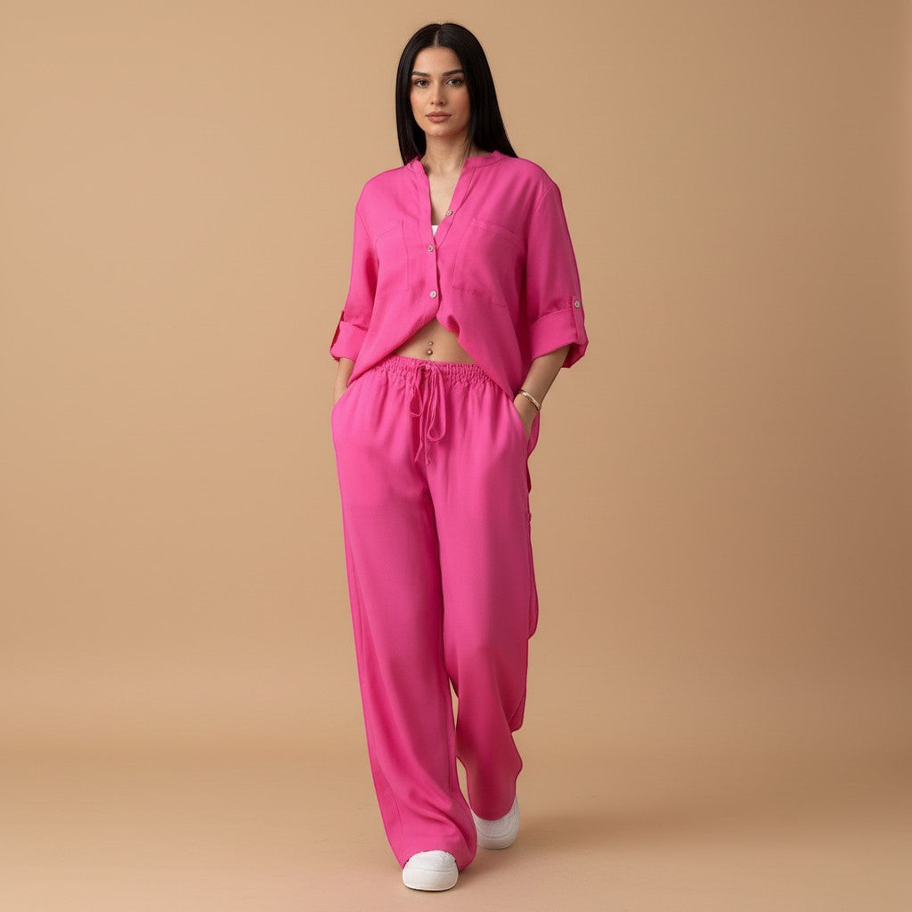 Yemelia bright pink relaxed fit button-down shirt and wide-leg pants set with drawstring waist.