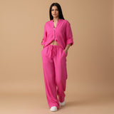 Yemelia bright pink relaxed fit button-down shirt and wide-leg pants set with drawstring waist.