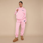 Yemelia pink relaxed fit cotton blend hoodie and jogger set with graphic accent and elastic waistband.