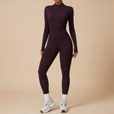 Yemelia plum purple long sleeve zip front sculpting one piece jumpsuit with a high neckline and full-length legs.