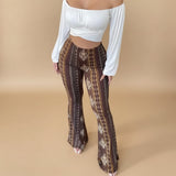 Yemelia brown and gold patterned high waist flared pants with stretch fit.