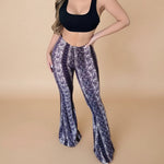 Yemelia printed high waist flared pants in white and purple paisley pattern. Stretch fit, pull-on style.