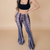 Yemelia printed high waist flared pants in white and purple paisley pattern. Stretch fit, pull-on style.