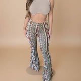 Yemelia high waist flared pants with all-over floral and geometric print, made from stretch fabric.