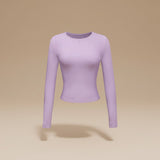 Yemelia light purple long sleeve fitted crop top with crew neck and thumbhole cuffs, made from soft stretch fabric.