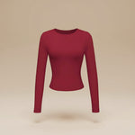 Yemelia long sleeve fitted crop top in deep red, made from soft stretch fabric with thumbhole cuffs.