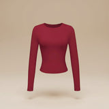 Yemelia long sleeve fitted crop top in deep red, made from soft stretch fabric with thumbhole cuffs.