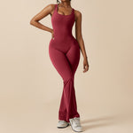 Yemelia sleeveless sculpting jumpsuit in deep red, featuring a clean neckline and flared legs for a flattering silhouette.