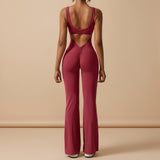Yemelia sleeveless sculpting flared leg jumpsuit in deep red with ruched back detail and a low scoop back.