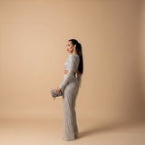 Yemelia silver sequin long sleeve crop top and wide leg pants evening set.