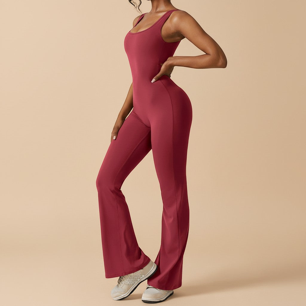 Yemelia sleeveless sculpting flared leg jumpsuit in deep red. Smooth, stretch fabric contours the body for a flattering fit.