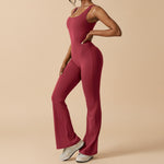 Yemelia sleeveless sculpting flared leg jumpsuit in deep red. Smooth, stretch fabric contours the body for a flattering fit.