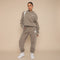 Yemelia taupe relaxed fit hoodie and jogger set with graphic accent, soft fabric, elastic waistband.