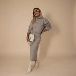 Yemelia taupe knit turtleneck sweater and midi skirt set. Relaxed fit sweater, fitted skirt, soft knit fabric.
