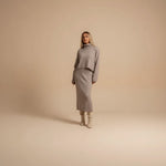 Yemelia taupe knit turtleneck sweater and midi skirt set. Relaxed fit sweater, fitted skirt, soft knit fabric.