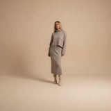 Yemelia taupe knit turtleneck sweater and midi skirt set. Relaxed fit sweater, fitted skirt, soft knit fabric.