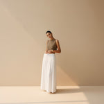 Yemelia sleeveless taupe textured knit crop top with a clean neckline and structured fit.