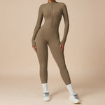 Yemelia taupe long sleeve zip front sculpting one piece jumpsuit with a high neckline and full-length fit.