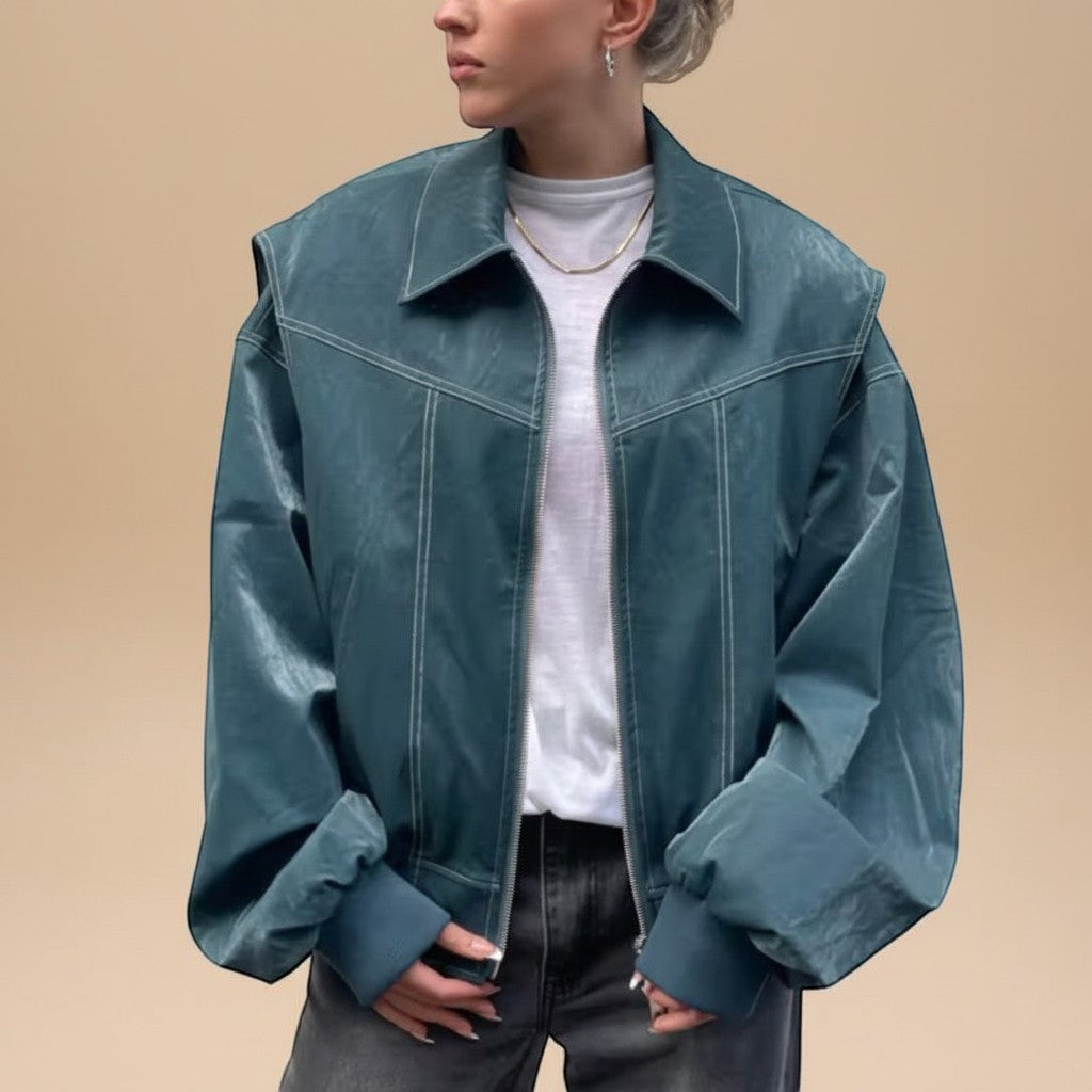Yemelia teal blue faux leather bomber jacket with zip front, ribbed trim, and contrast stitching.