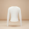 Yemelia white long sleeve fitted crop top with thumbhole cuffs, made from soft stretchy fabric.