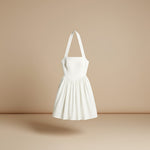 Yemelia white halter neck fit and flare midi dress with a structured bodice and flowing skirt.