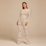Yemelia white lace sequin jumpsuit with long sleeves, structured waist, and wide legs. Ideal for formal events.