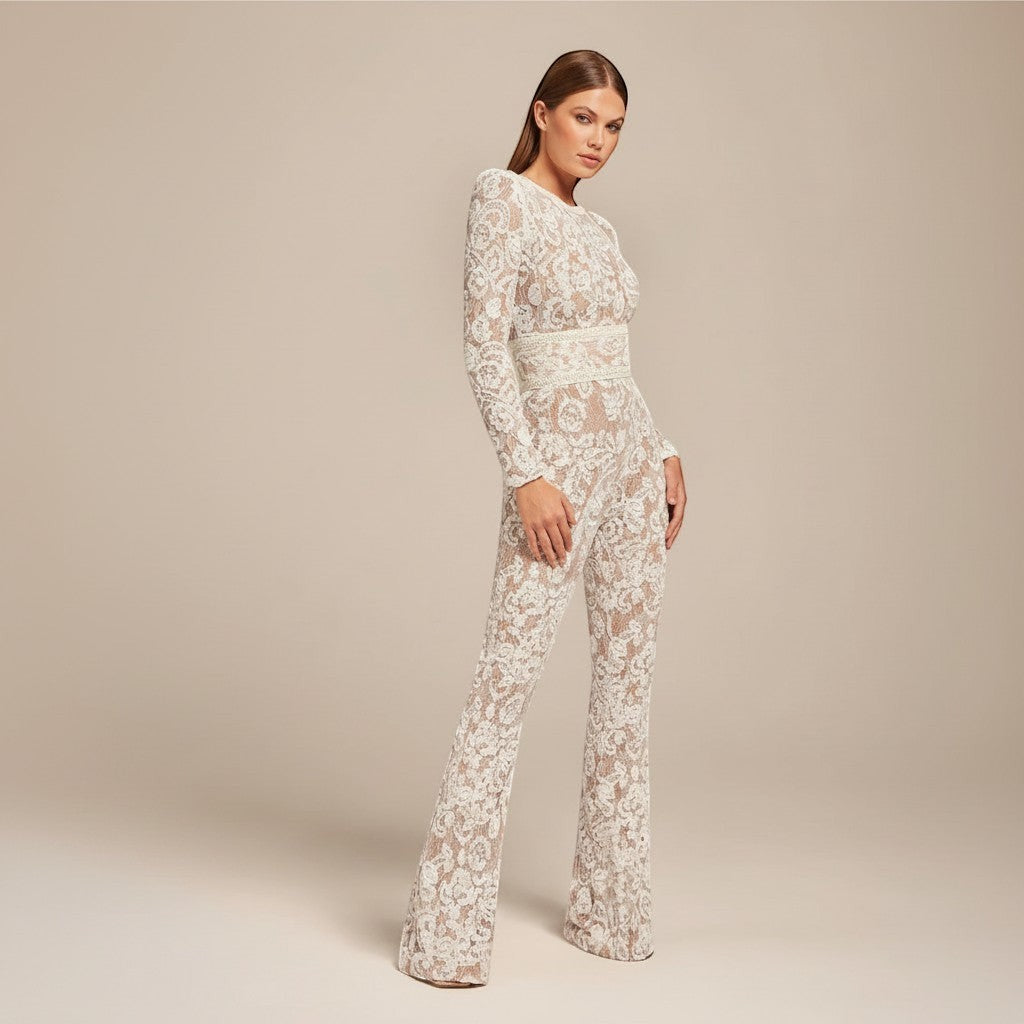 Yemelia white lace sequin jumpsuit with long sleeves, structured waist, and wide legs. Ideal for formal events.