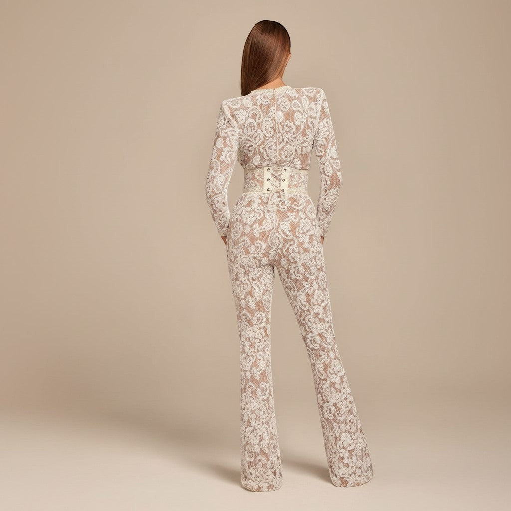 Yemelia white lace sequin jumpsuit with long sleeves, structured waist, and wide legs. Ideal for formal events.