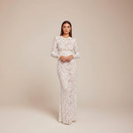 Yemelia white lace sequin jumpsuit with long sleeves, structured waist, and wide legs. Ideal for formal events.