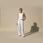 Yemelia white linen sleeveless crop top and wide leg pants set with elastic waistband. Lightweight and breathable for warm weather.