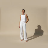 Yemelia white linen sleeveless crop top and wide leg pants set with elastic waistband. Lightweight and breathable for warm weather.