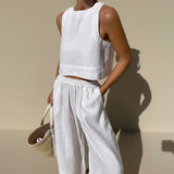 Yemelia white linen-style sleeveless crop top and wide leg pants set with elastic waistband.