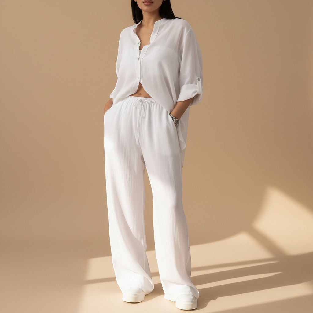 Yemelia white relaxed fit button-down shirt and wide-leg pants set, lightweight textured fabric, drawstring waist.