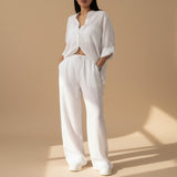 Yemelia white relaxed fit button-down shirt and wide-leg pants set, lightweight textured fabric, drawstring waist.