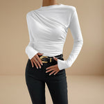 Yemelia white long sleeve fitted top with asymmetrical ruching on the bodice and neckline. Stretch fabric.