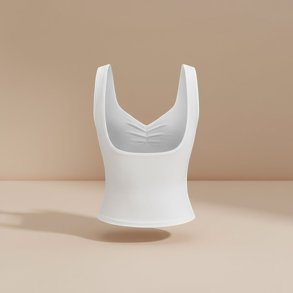 Yemelia white ruched bust square neck sleeveless fitted top made of stretch fabric.