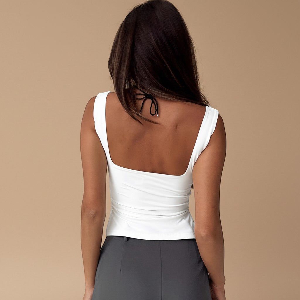 Yemelia white square neck sleeveless ruched bust fitted top made of stretch fabric.