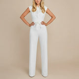 Yemelia white sleeveless wide leg jumpsuit with tie waist and structured bodice.