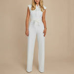 Yemelia white sleeveless wide leg jumpsuit with tie waist. Elegant and tailored for formal events or workwear.