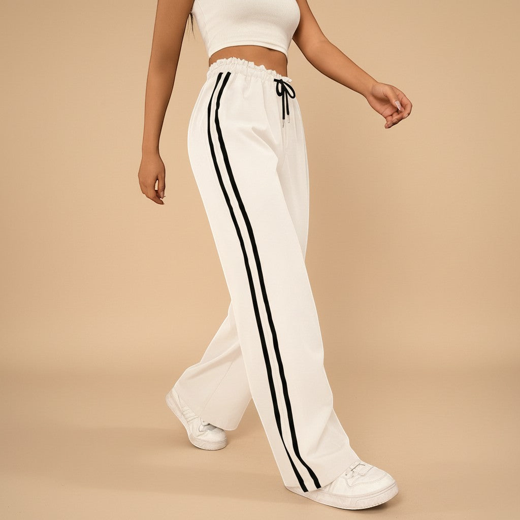 Yemelia white high waist wide leg track pants with black side stripe detail and drawstring waist.