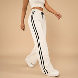 Yemelia white high waist wide leg track pants with black side stripe detail and drawstring waist.