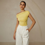 Yemelia yellow one shoulder ruched fitted top with asymmetrical neckline and stretch fabric.